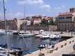 Alghero: il porto di Alghero con sullo sfondo il forte e la Torre della Maddalena