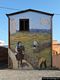 Loculi-Murales sulle pareti delle abitazioni di Loculi