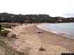 Loiri: il porto Taverna: la spiaggia e scogli a Porto Taverna
