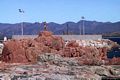 Tortolì-Arbatax: entrando sul piazzale si cominciano a vedere sulla sinistra le bellissime rocce rosse di Arbatax