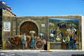 Baressa-Un murale nel centro storico che illustra il mercato delle mandorle