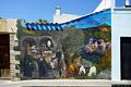 Baressa-Un murale nel centro storico che illustra scene di vita contadina