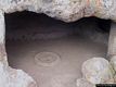 Bonorva-La necropoli di Sant’Andrea Priu: interno di una domus de janas con ben in vista le coppelle scavate nel pavimento