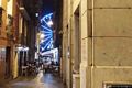 Cagliari-Lungo la traversa via Barcellona la Trattoria da Tonio ed alla fine della strada la ruota panoramica illuminata