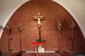 Cagliari-La chiesa parrocchiale dei Santi Martiri Giorgio e Caterina: crocefisso ligneo con i lampioni in legno dorato usati nelle processioni
