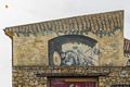 Cargeghe-Particolare del murale 'Architetture con attrezzi agricoli e figure femminili'
