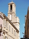 Carloforte-chiesa parrocchiale di San Carlo Borromeo: campanile visto dal fianco sinistro rimasto libero che consente l’apertura delle finestre