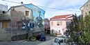 Esterzili: la piazza Barbagia con il murale del treno