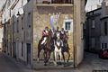 Fonni: il murale 'Cavalieri a cavallo con lo stendardo processionale'