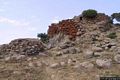 Macomer-Area archeologica di Tamuli: il nuraghe con veduta di una delle torri latarali