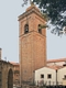 Meana Sardo-chiesa parrocchiale di San Bartolomeo Apostolo: veduta del campanile dal proseguimento della via Trieste