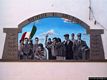 Montresta-Un murale sulle case del paese