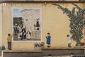 Muros-Murales di Cristian lubinu figure femminili alla fonte con bambini