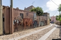 Nureci-il murale che rappresenta una processione religiosa con animali, figure maschili e figure femminili