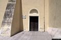 Onifai: chiesa parrocchiale de Santo Sostiano ossia di San Sebastiano: il portoncino laterale