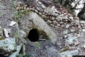 Orgosolo-Area archeologica di Sirilò: ingresso della tomba sulla quale è stato edificato il tempietto