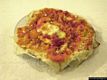 Porto Torres: il ristorante li lioni: <em>Pane frattau</em>, piatto nuorese ottenuto con <em>Panecarasau</em> ammorbidito nel brodo e condito con pomodoro, formaggio e uovo in camicia