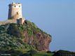 Pula-Nora: la Torre del Coltellazzo con il faro della stazione semaforica di capo Pula Pula-Nora: la Torre del Coltellazzo con il faro della stazione semaforica di capo Pula