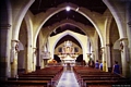 San Gavino Monreale-chiesa parrocchiale di Santa Chiara Vergine: la navata centrale verso l’altare