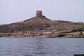 San Giovanni del Sinis: veduta dal mare di capo San Marco con la Torre di San Giovanni che sovrasta i resti di Tharros