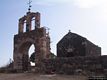 Solarussa: chiesa romanica di San Gregorio: veduta della chiesa sul retro del portale della muraglia