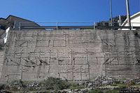 Ulassai-Il muro con la strada delle capre cucite di Maria Lai