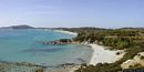 Villasimius: veduta della spiaggia di Porto luna con dopo il promontorio la spiaggia di Is Traias